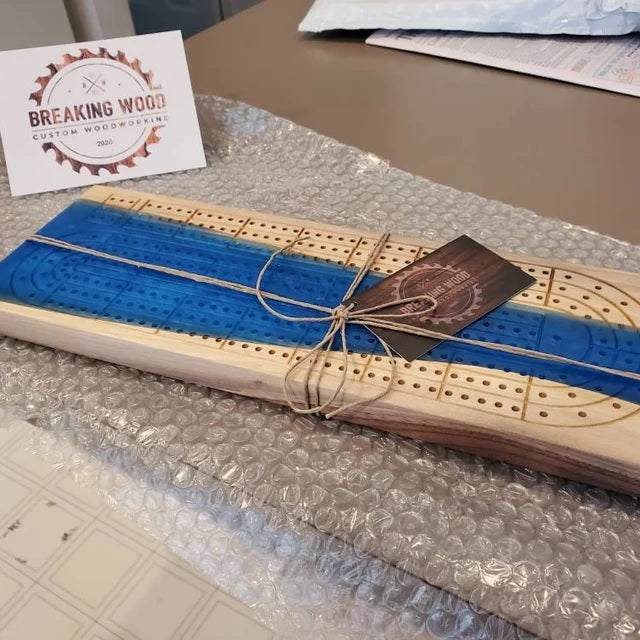 Custom blue resin and wood cribbage board